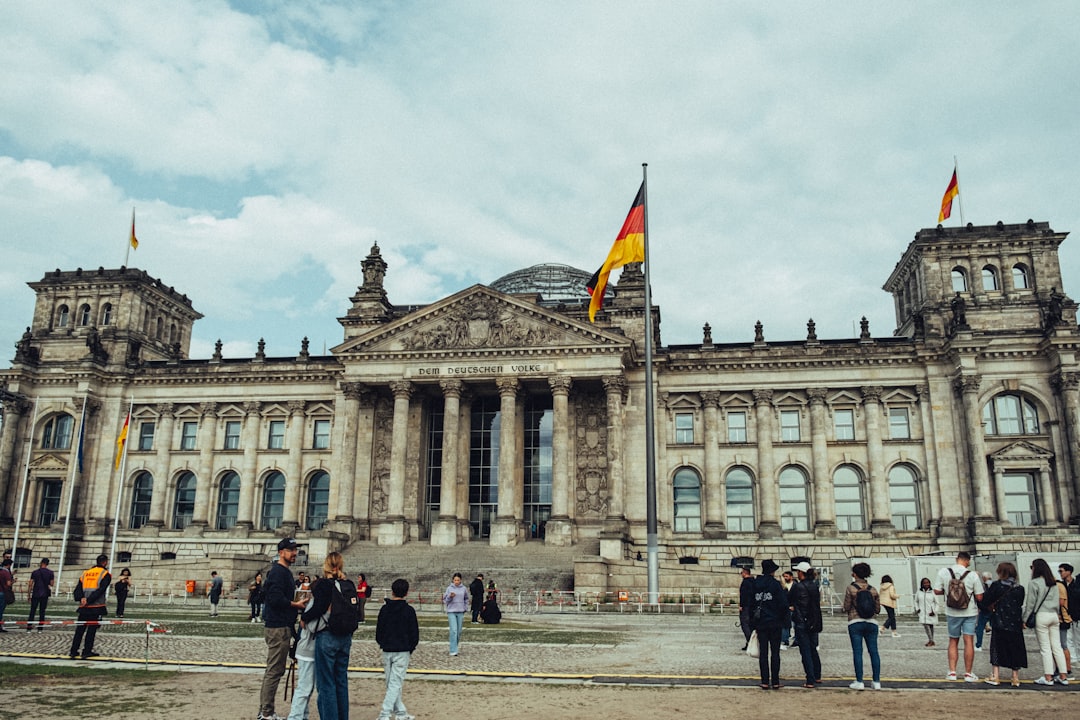 how to get germany free scholarship concept - People are gathered in front of a german building.