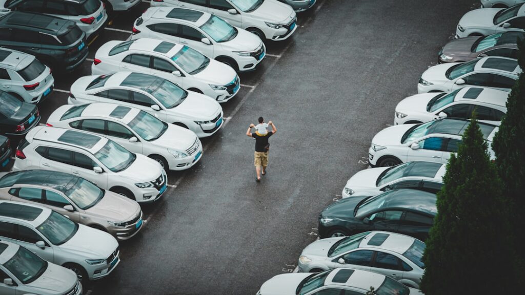 How to get a car from dealership - a person standing in a parking lot
