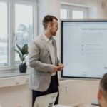 digital marketing strategies - a man giving a presentation to a group of people