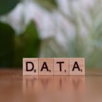 how to fix corrupted data - A wooden block spelling data on a table