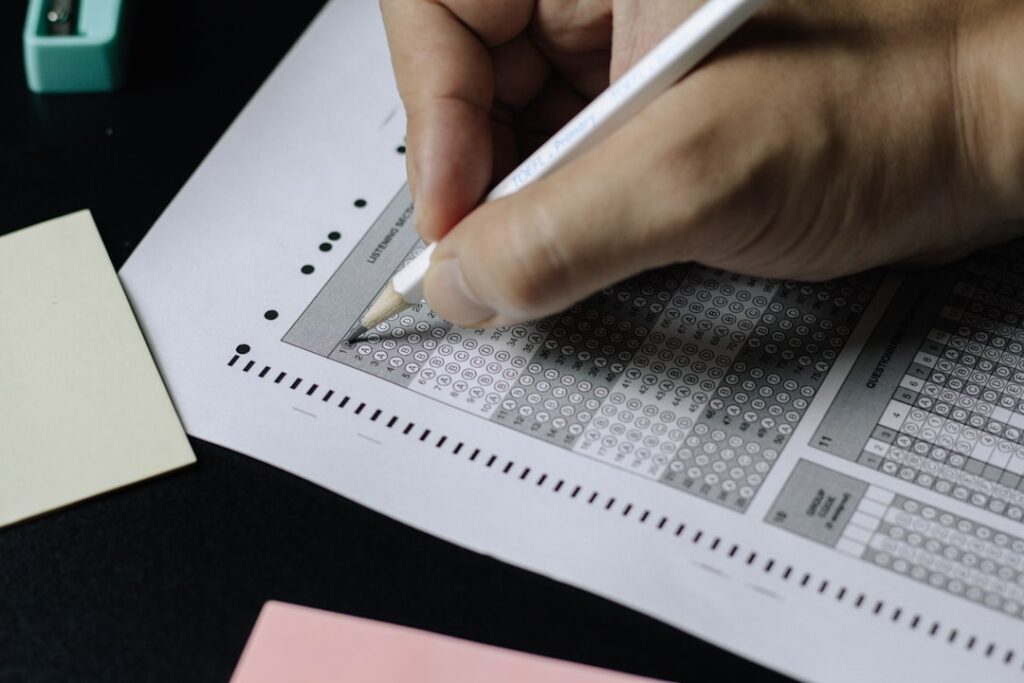 test - person writing on white paper