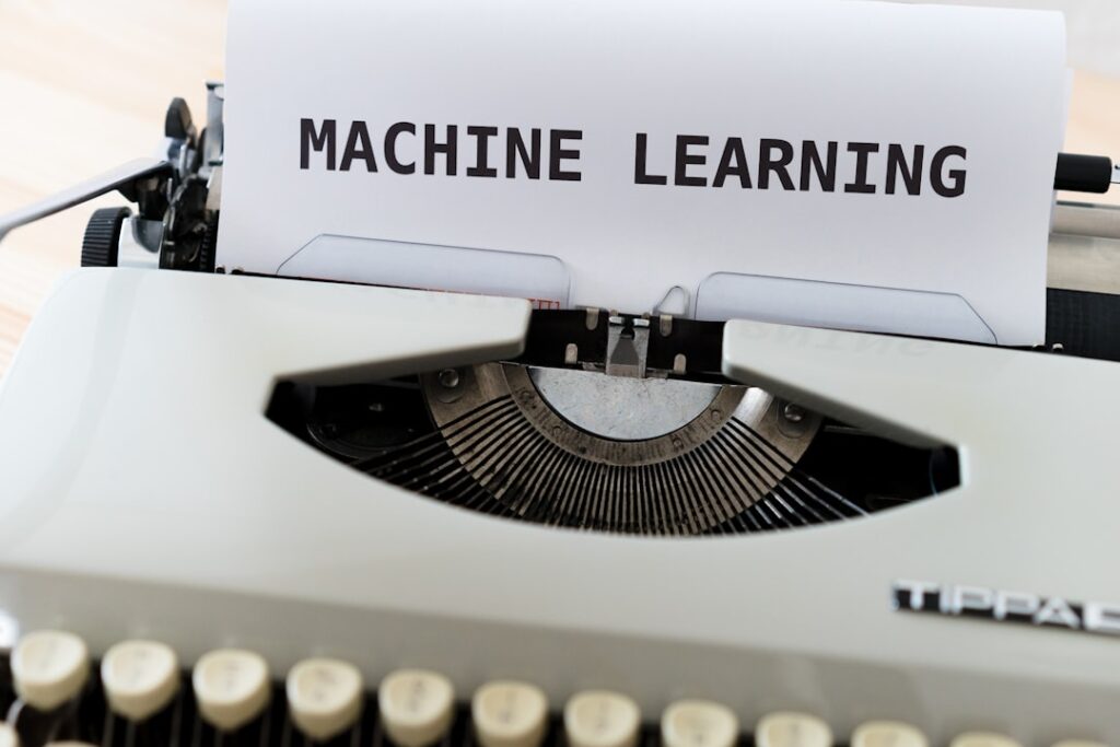 what is machine learning - a close up of a typewriter with a paper reading machine learning